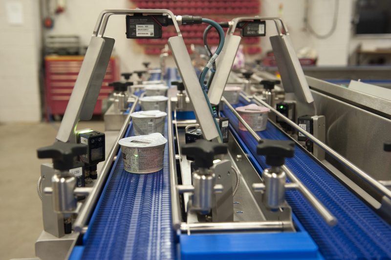 QR Code Verification Unit mounted over a production line scanning tubs